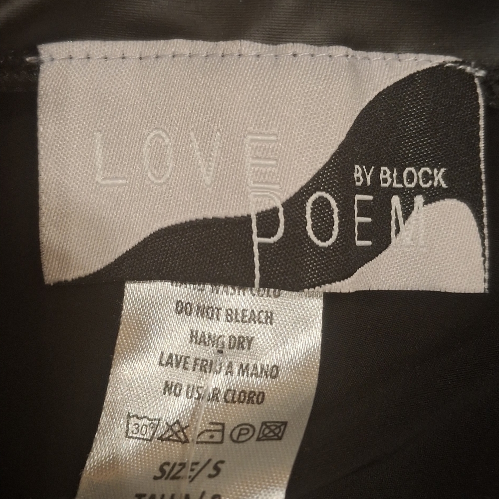 High-Shine Black Faux Leather Mini Skirt with Gold Zipper Detail - Picture 2 of 2